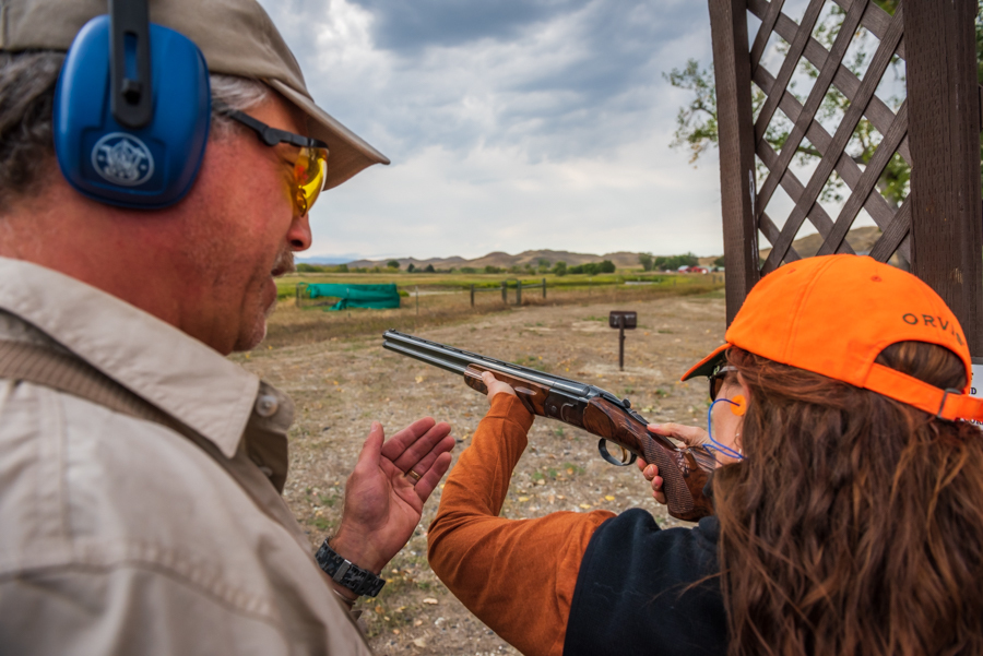 Guide assists sporting clay shooter